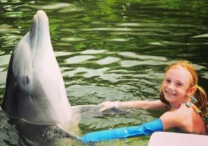 Swimming with the dolphin with a cast